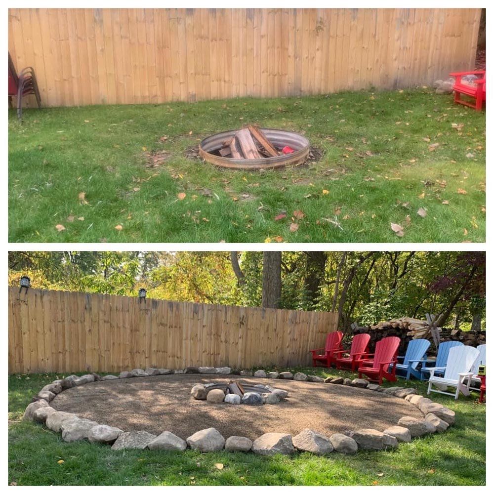 A woman is standing in front of a fire pit in a circle. fire pit