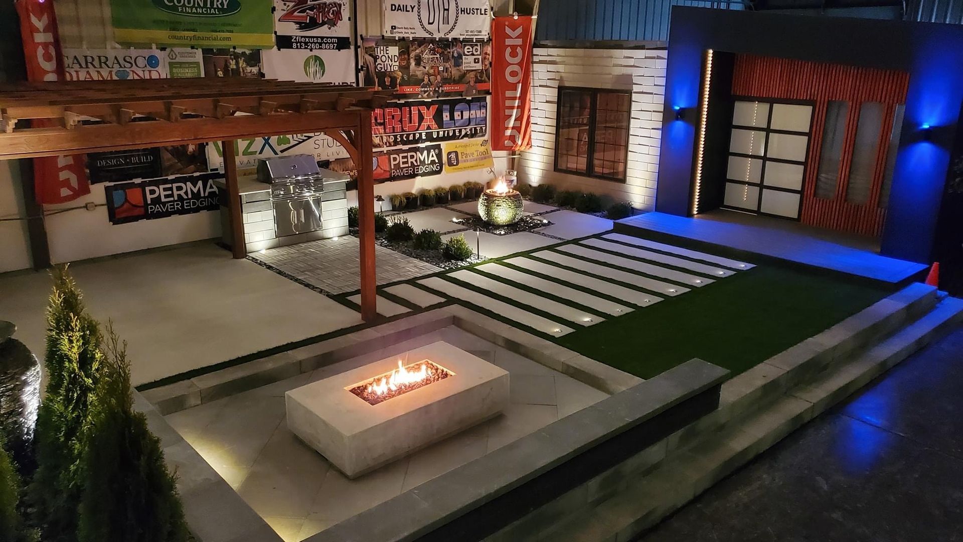 There is a fire pit in the middle of the yard. outdoor kitchen