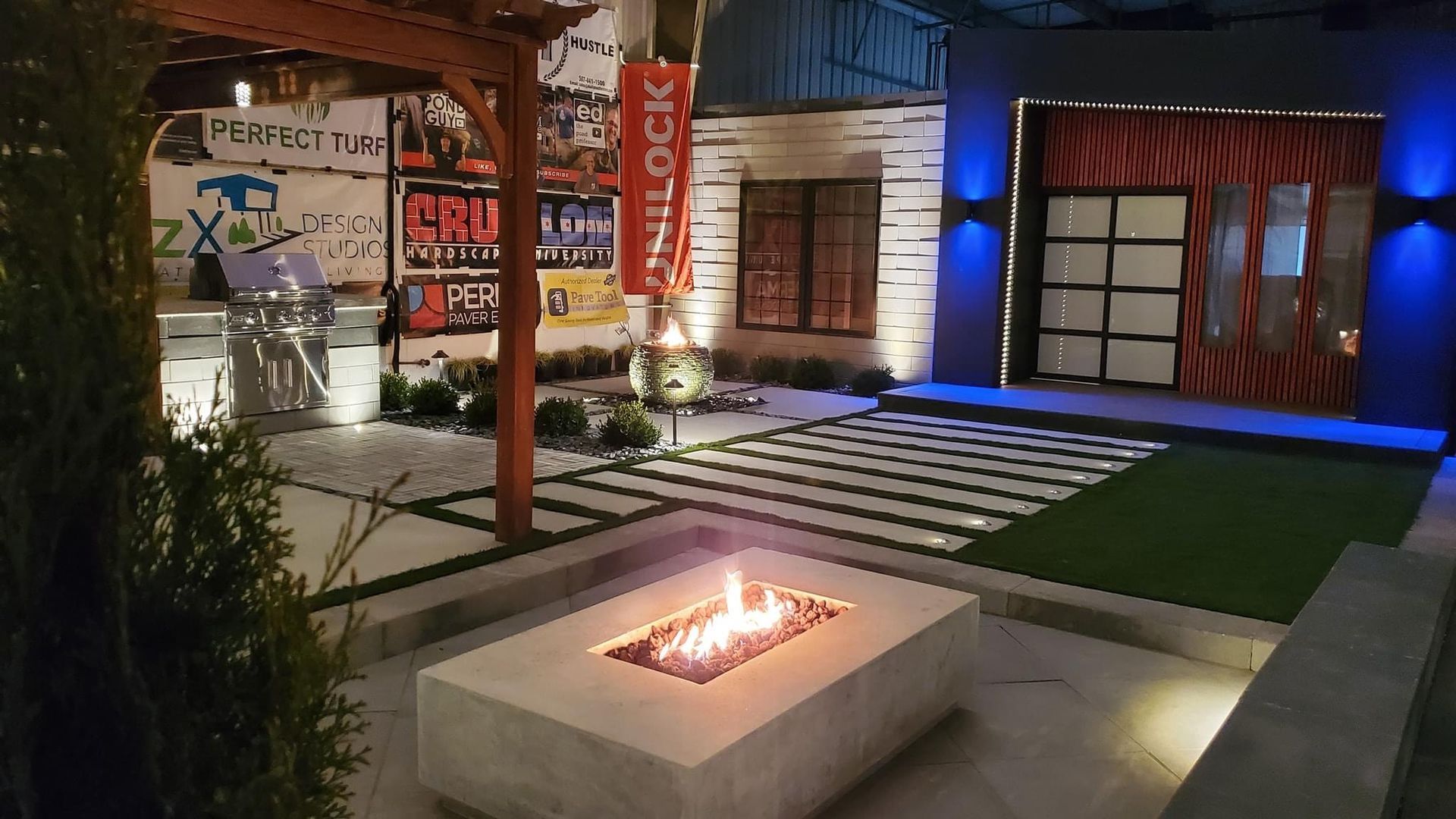 There is a fire pit in the middle of the patio. fire and lights