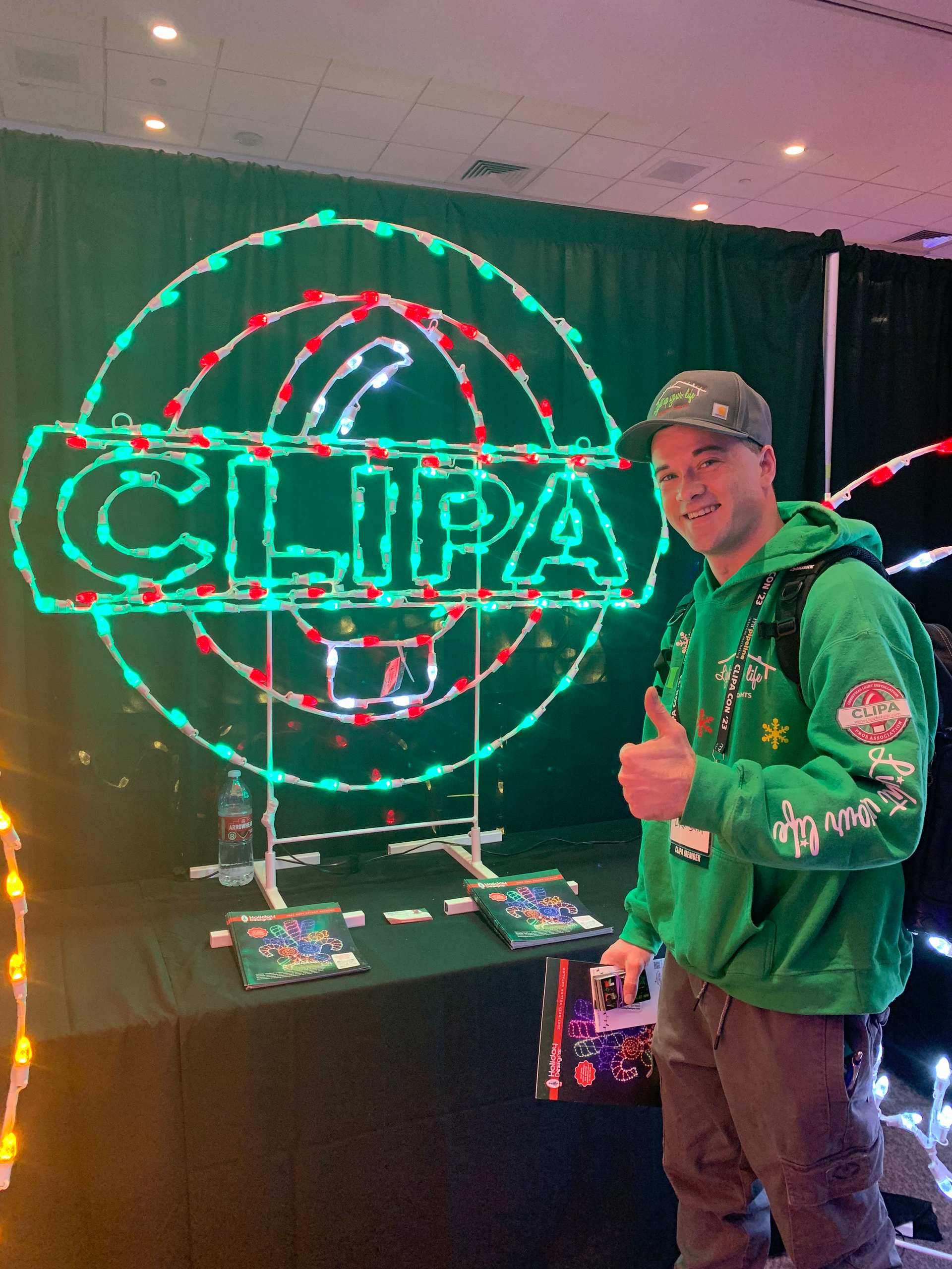 A white truck is parked in front of a large house under construction. Kodak retaining wall