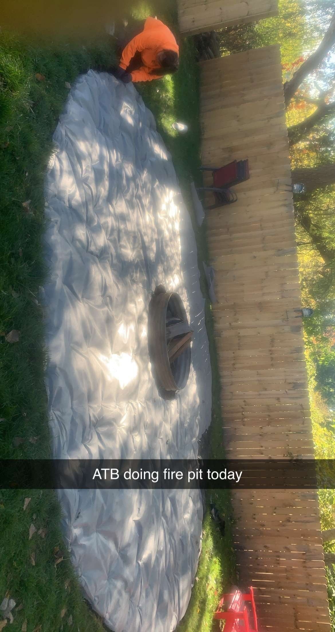 A brick house with a patio and a rv parked in front of it. brick paver patio.
