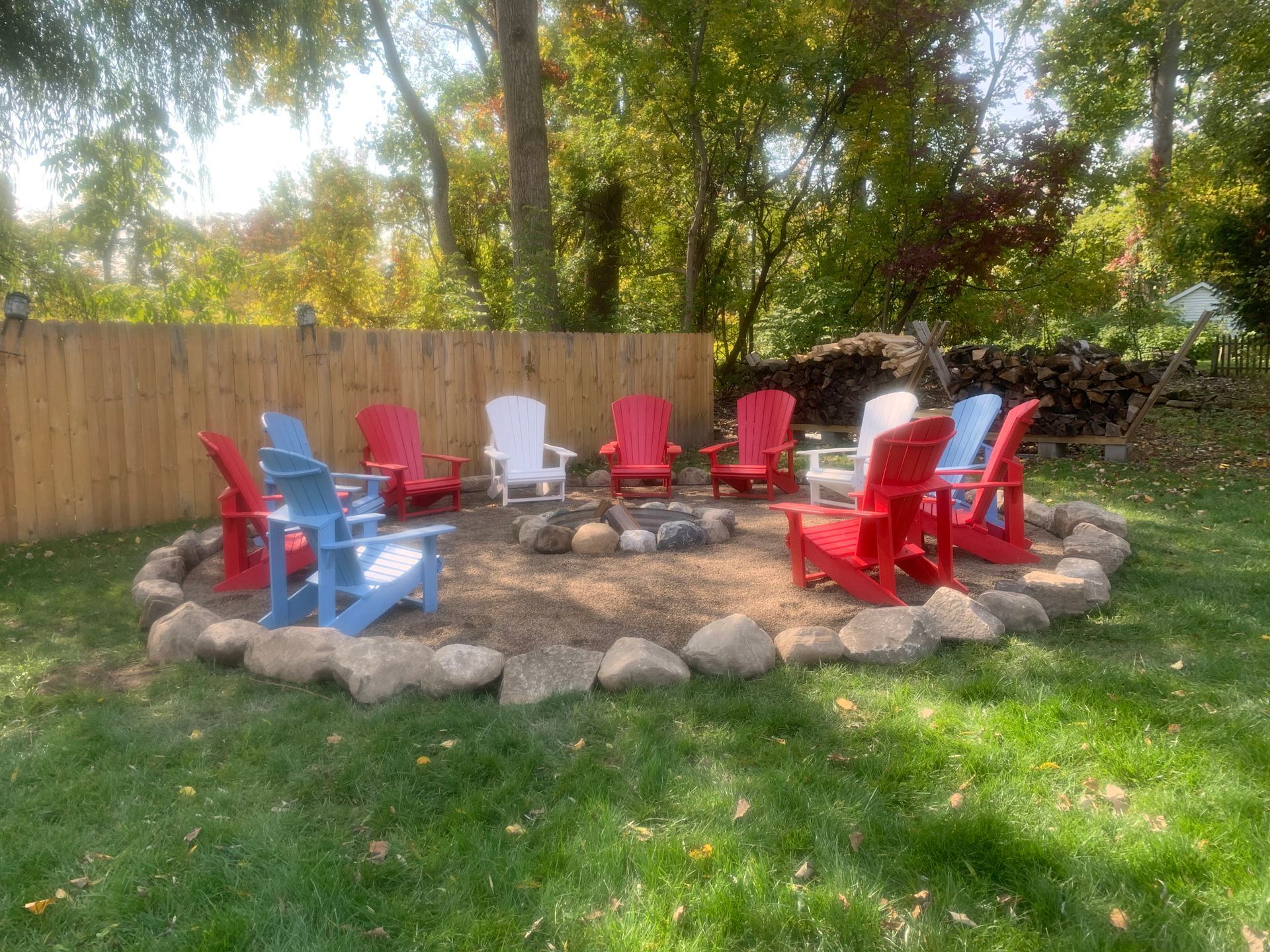 A house with a boat in the backyard is for sale. retaining wall