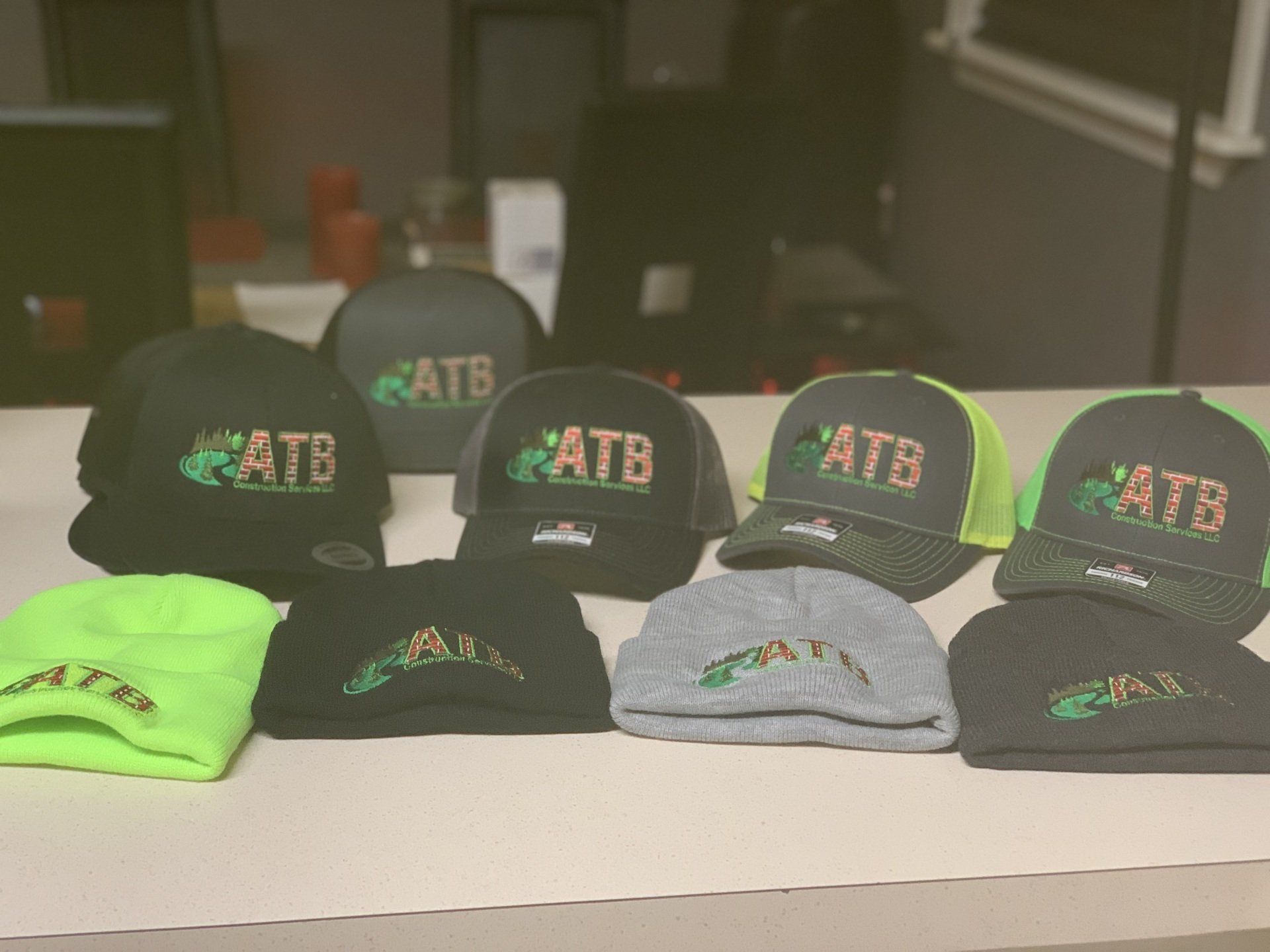 A man wearing a hat and a hoodie is smiling in front of a truck. outdoor living