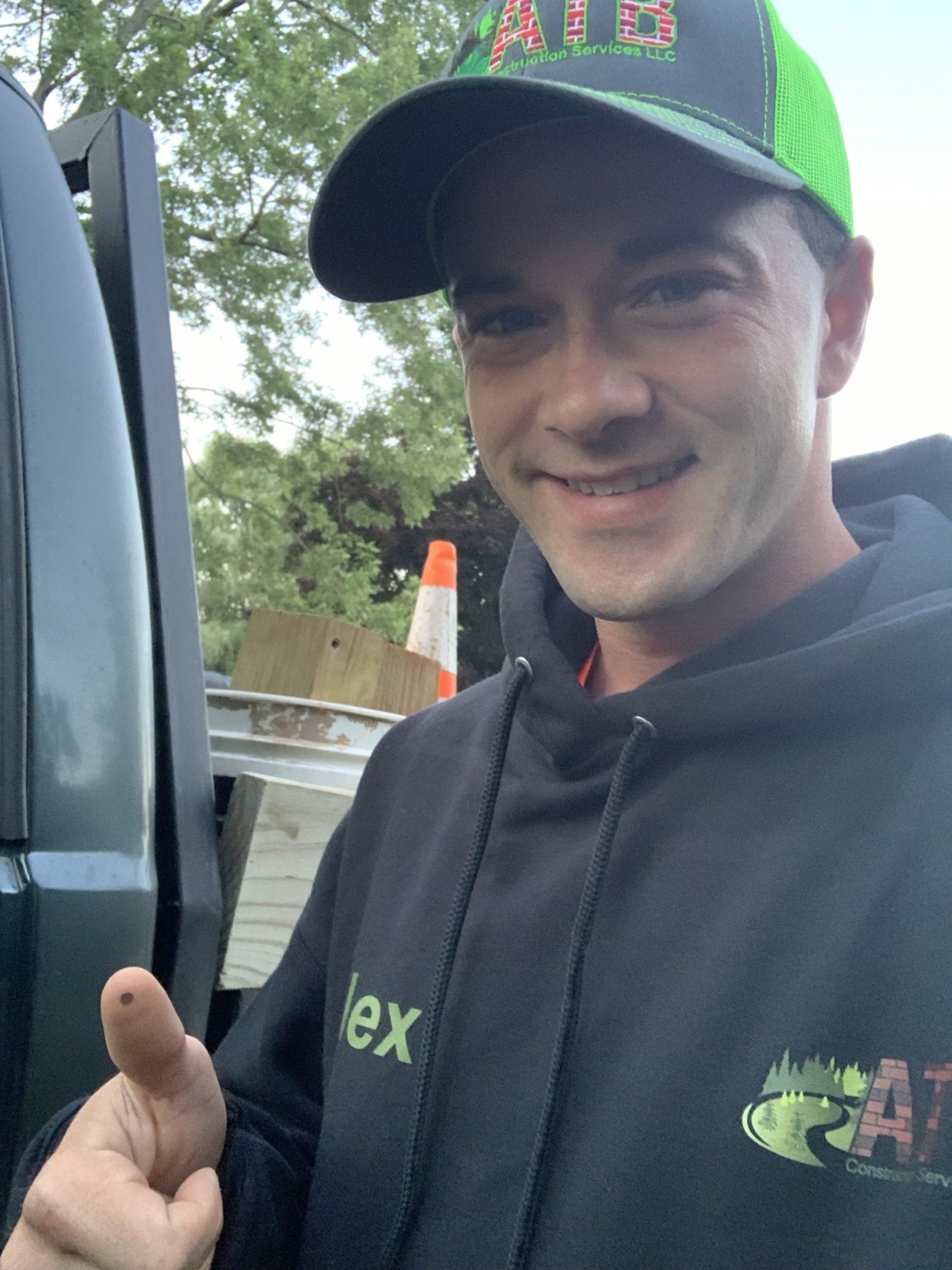 A bunch of hats and beanies are sitting on a table. brick pavers