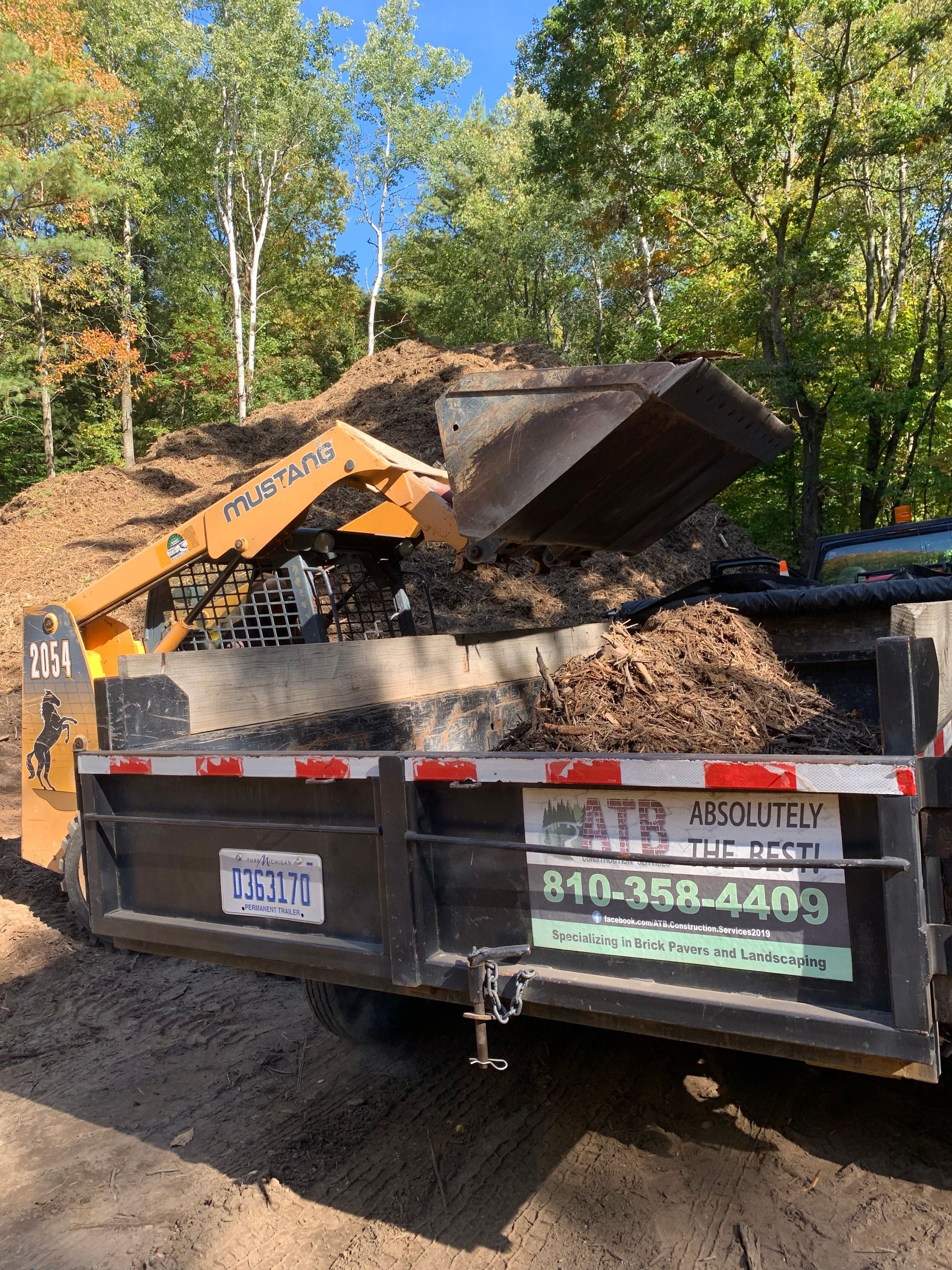 A red and white wooden walkway leading to a house with a white deck. waterfall