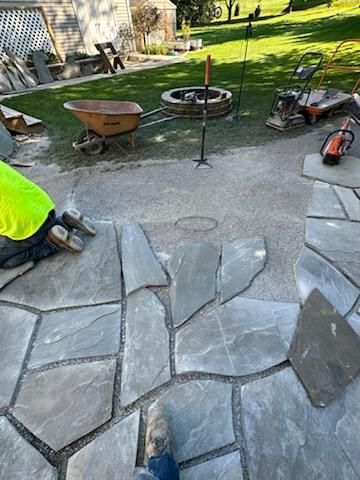 A bucket of perma paver edging original formula. concrete