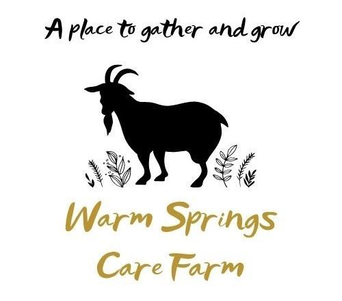 The logo for warm springs care farm shows a goat standing in the grass.