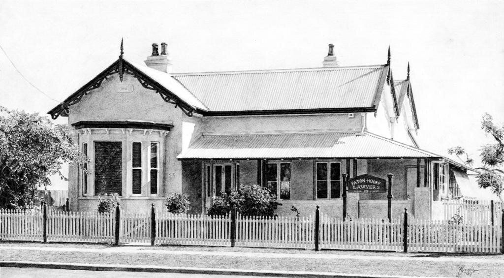 A Black and White Photo of a House With a Fence Around It — Paton Hooke Lawyers & Conveyancers In Taree, NSW