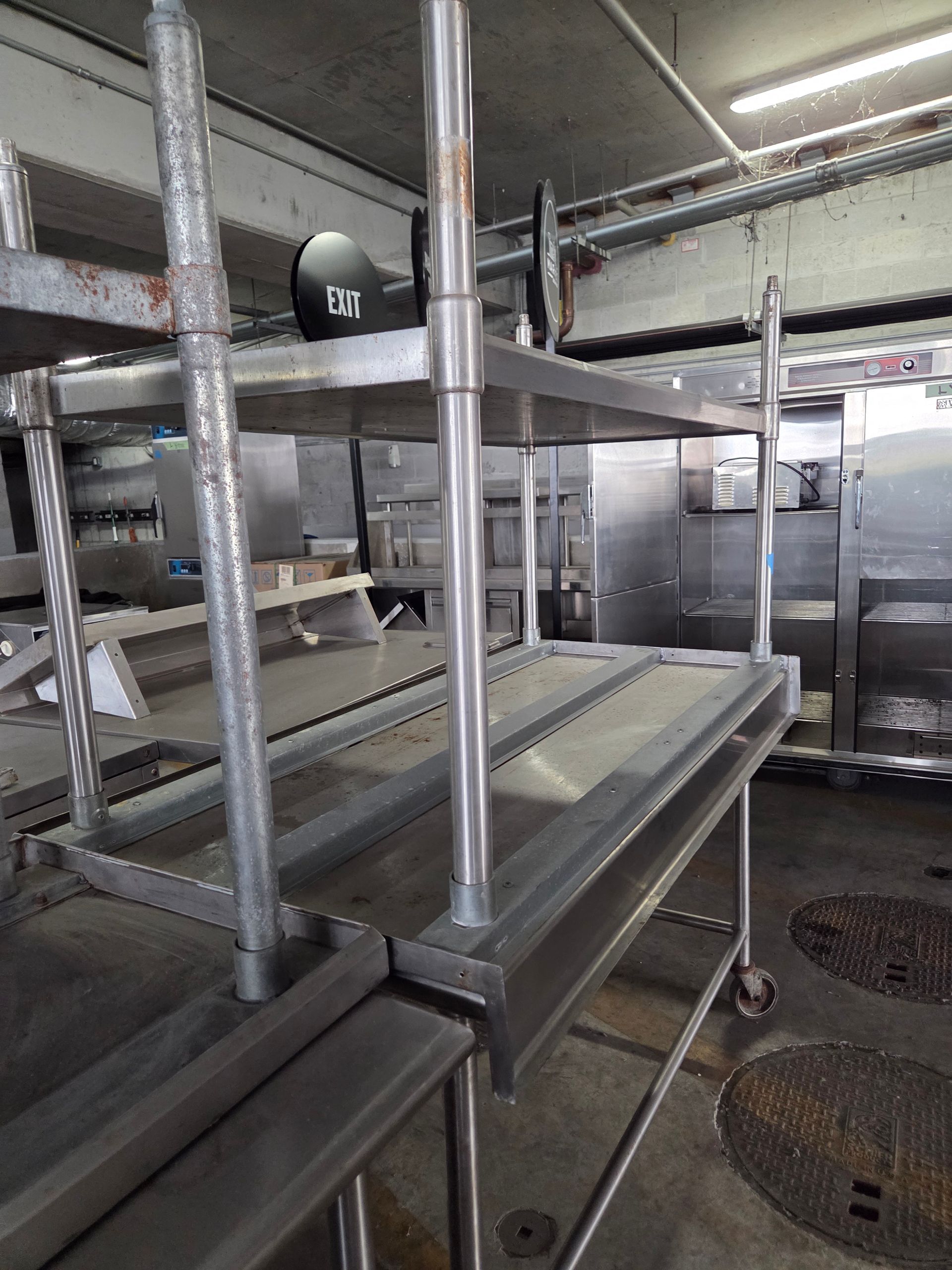 Stainless steel shelving unit in a commercial kitchen.