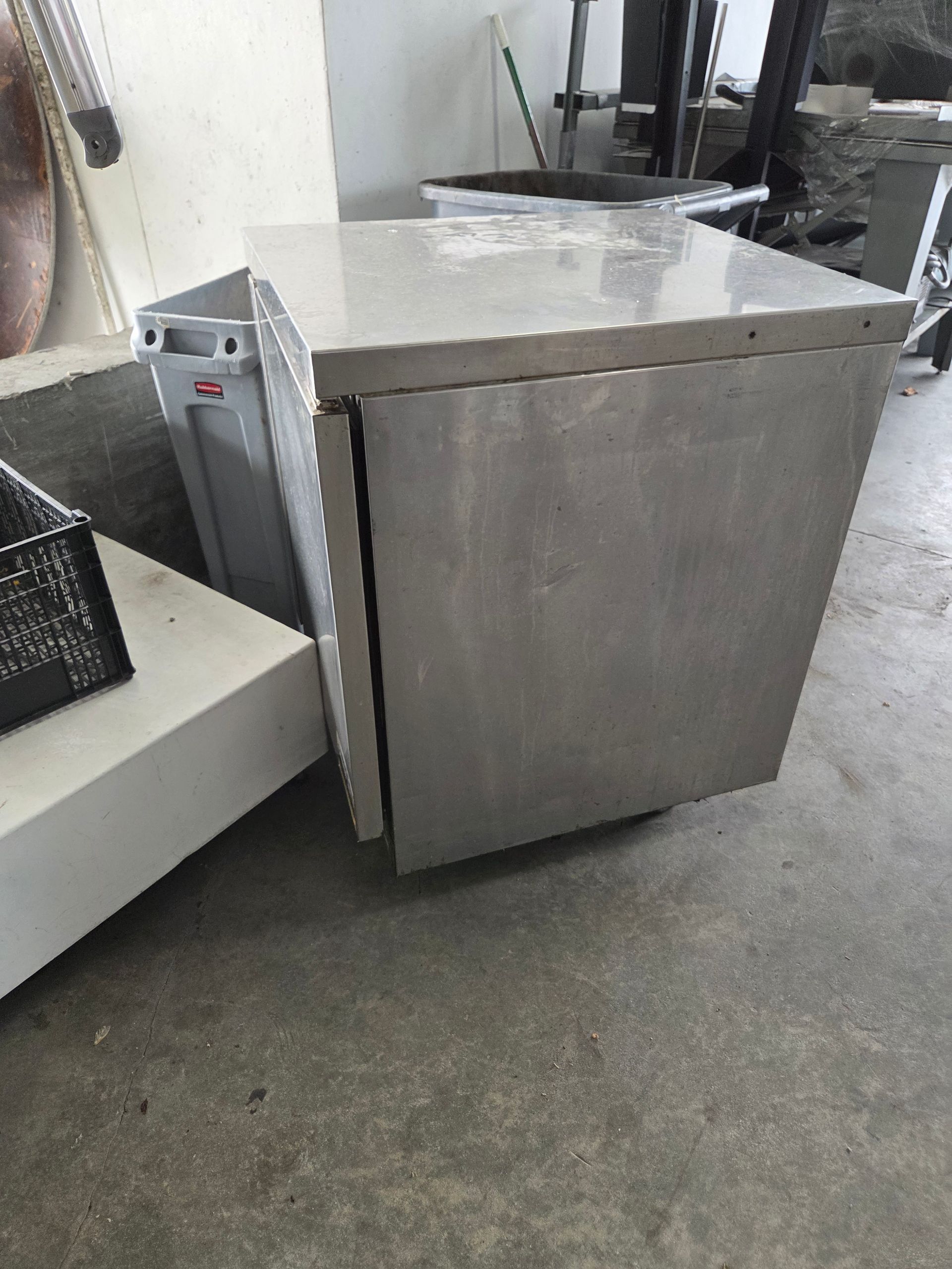 Stainless steel cabinet with a closed door.