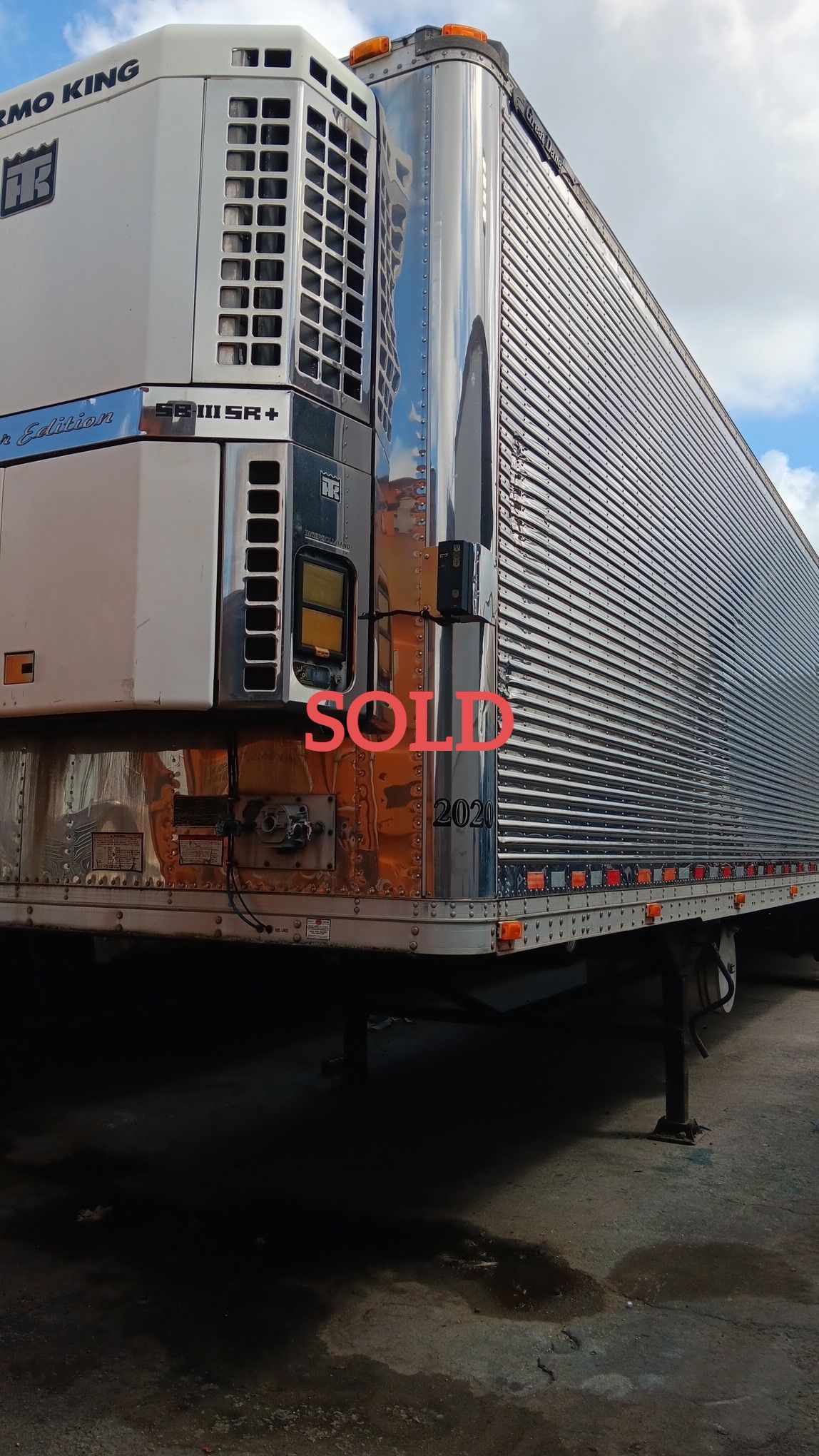 Refrigerated semi-trailer, chrome and white, with 