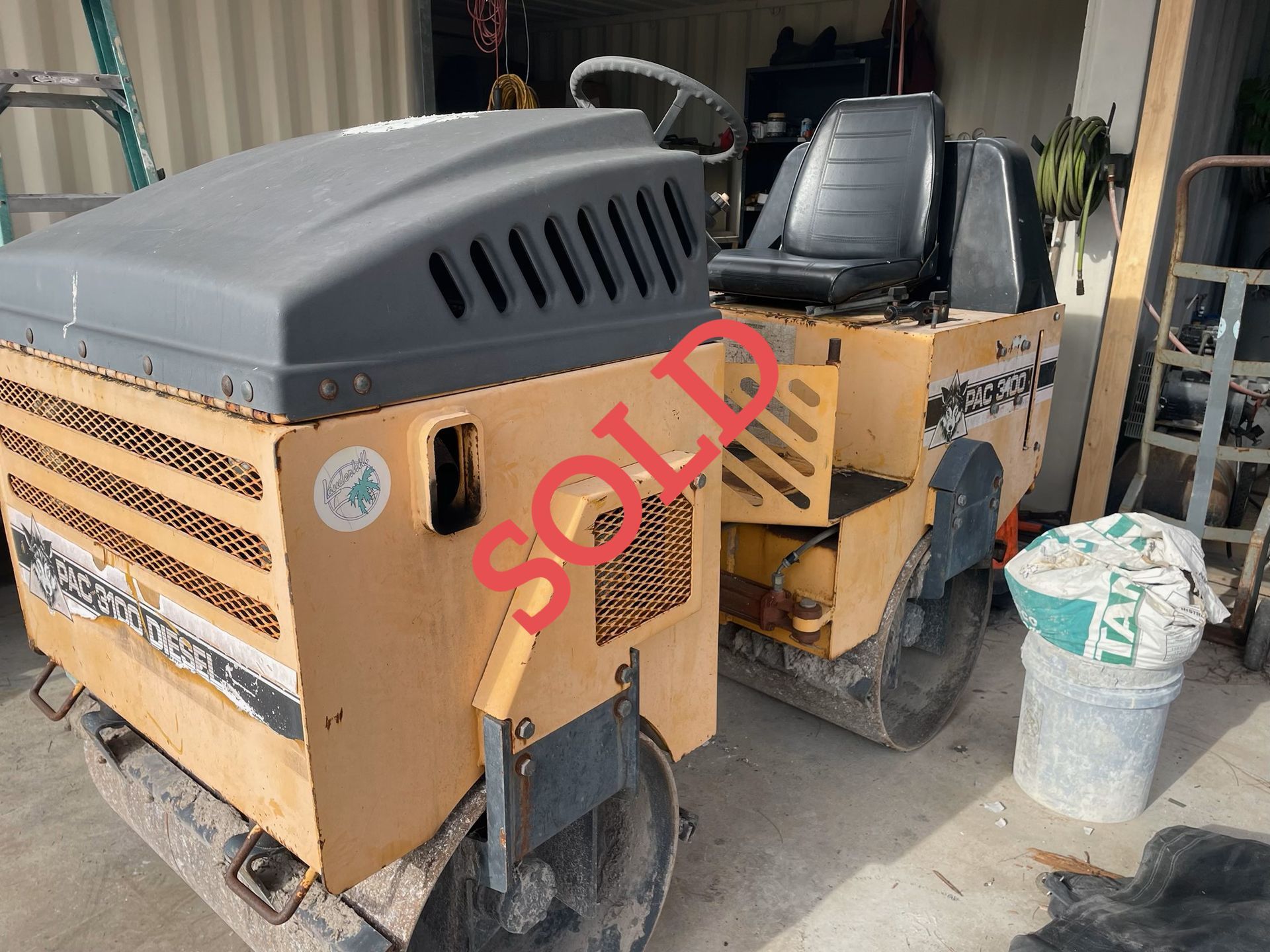 Yellow and gray road roller with 