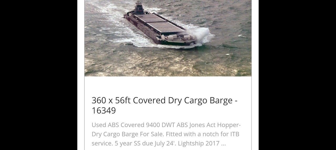 A barge on water with text below that reads 