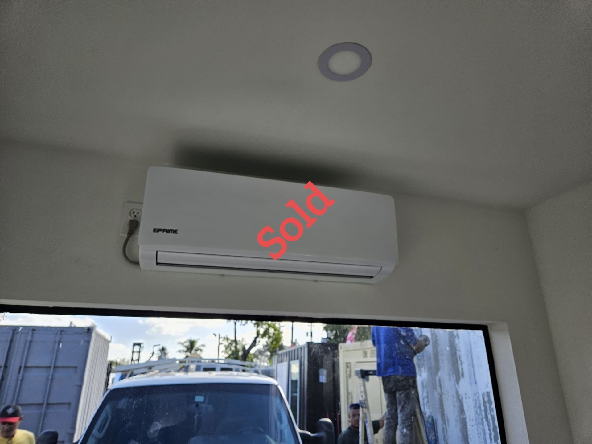 Air conditioner unit on a white wall, with 