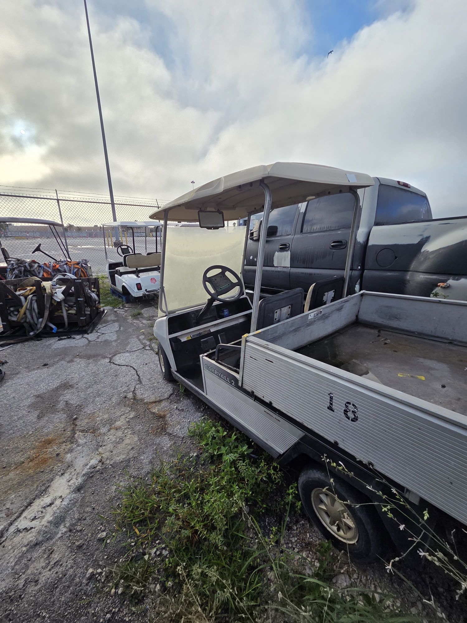 A utility golf cart, labeled 