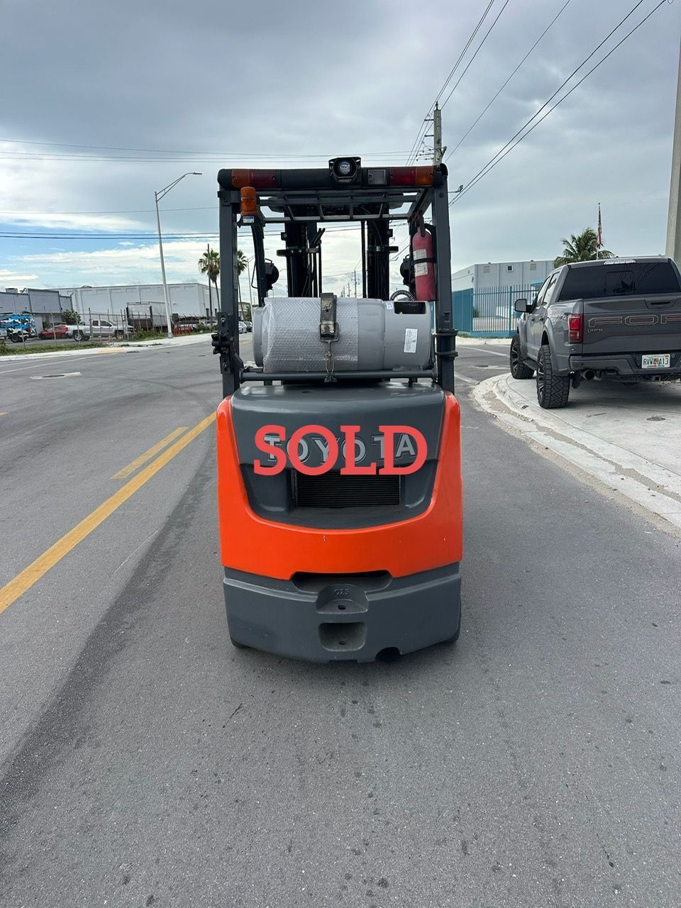 Forklift on a road, marked 