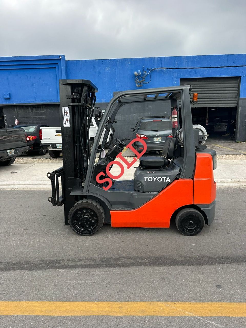 Orange Toyota forklift marked 