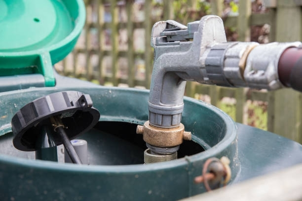 A hose is being connected to a gas tank.