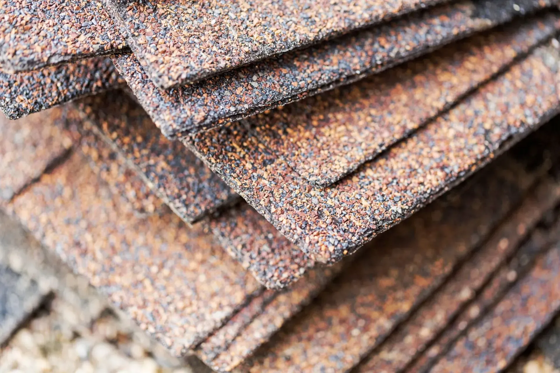 A close up of a pile of rubber sheets stacked on top of each other.