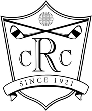 A black and white logo for a golf club with a shield and crossed golf clubs.