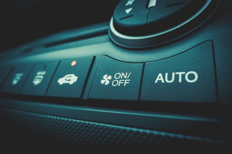 Car's Climate Control Panel With Buttons For Air Conditioning — MC Automotive Service & Repairs in Maitland, NSW
