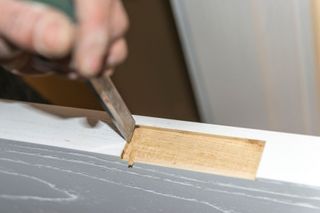 Kent Handyman installing door hardware