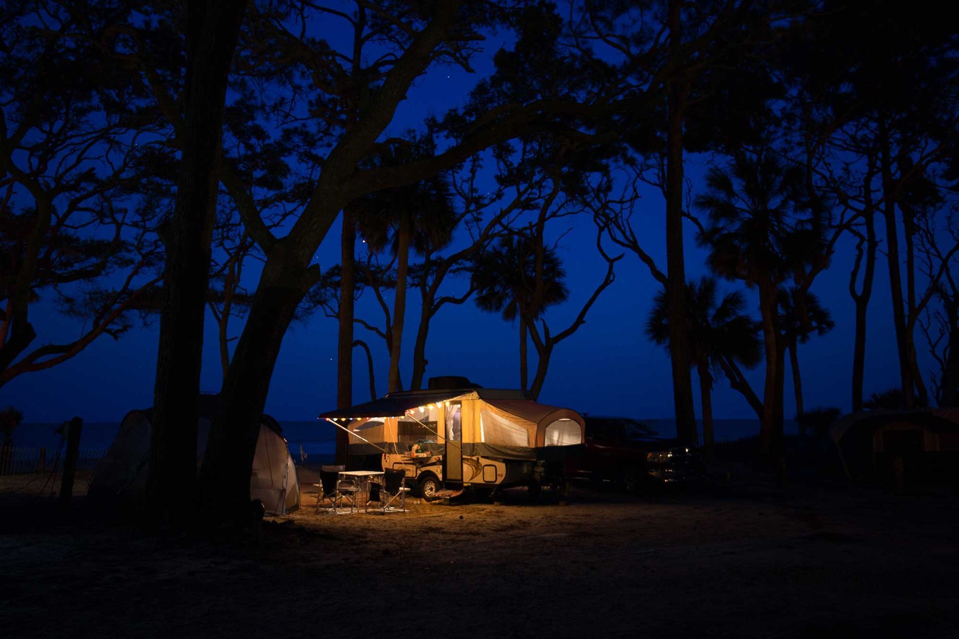 An evening campsite under the Live Oaks and Palmetto trees of Hunting Island State Park, South Carolina. Photo provided by Mac Stone.