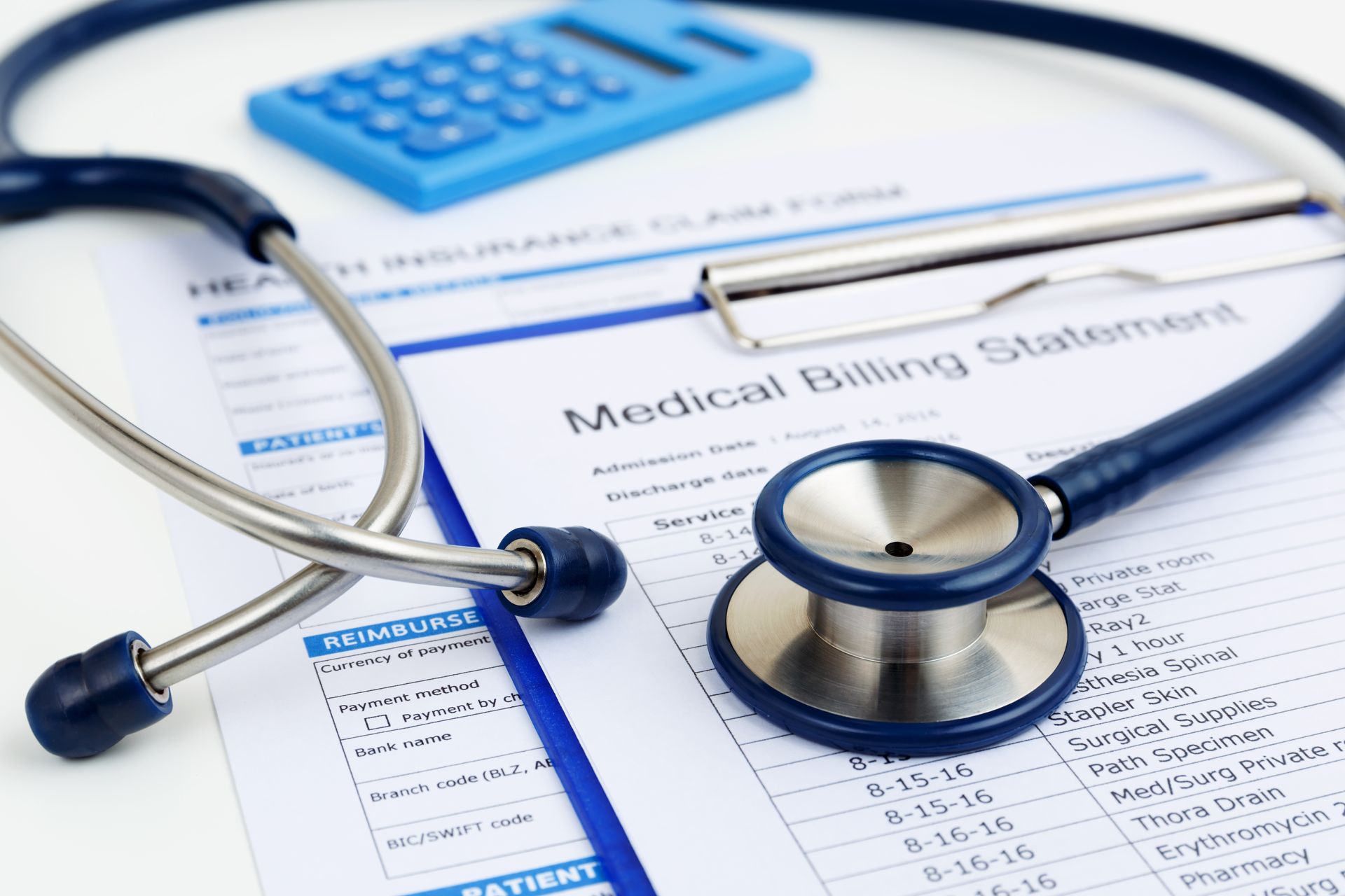 A stethoscope is sitting on top of a medical billing statement