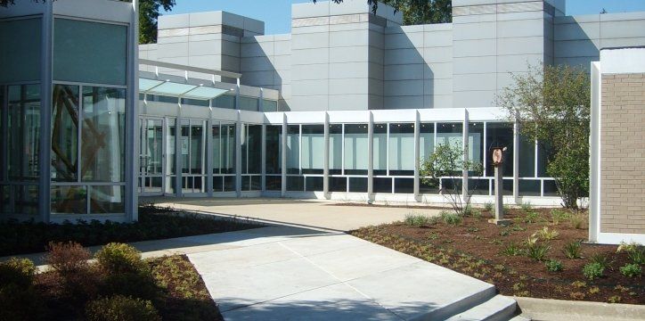 A large building with a walkway leading to it