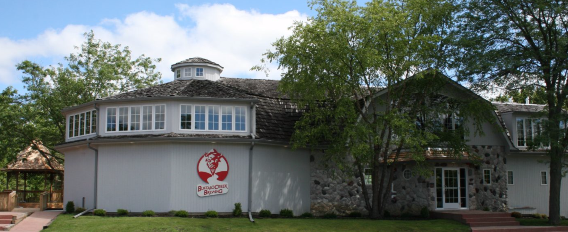 A large white house with a red logo on the side