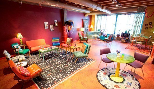 A living room filled with colorful furniture and a table