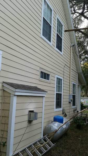 A house with windows and exterior cleaned by Joes Window Washing and pressure washing. Cheap