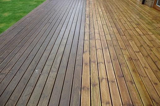 A before and after picture of a wooden deck. After Joes Window Washing cleaned it.