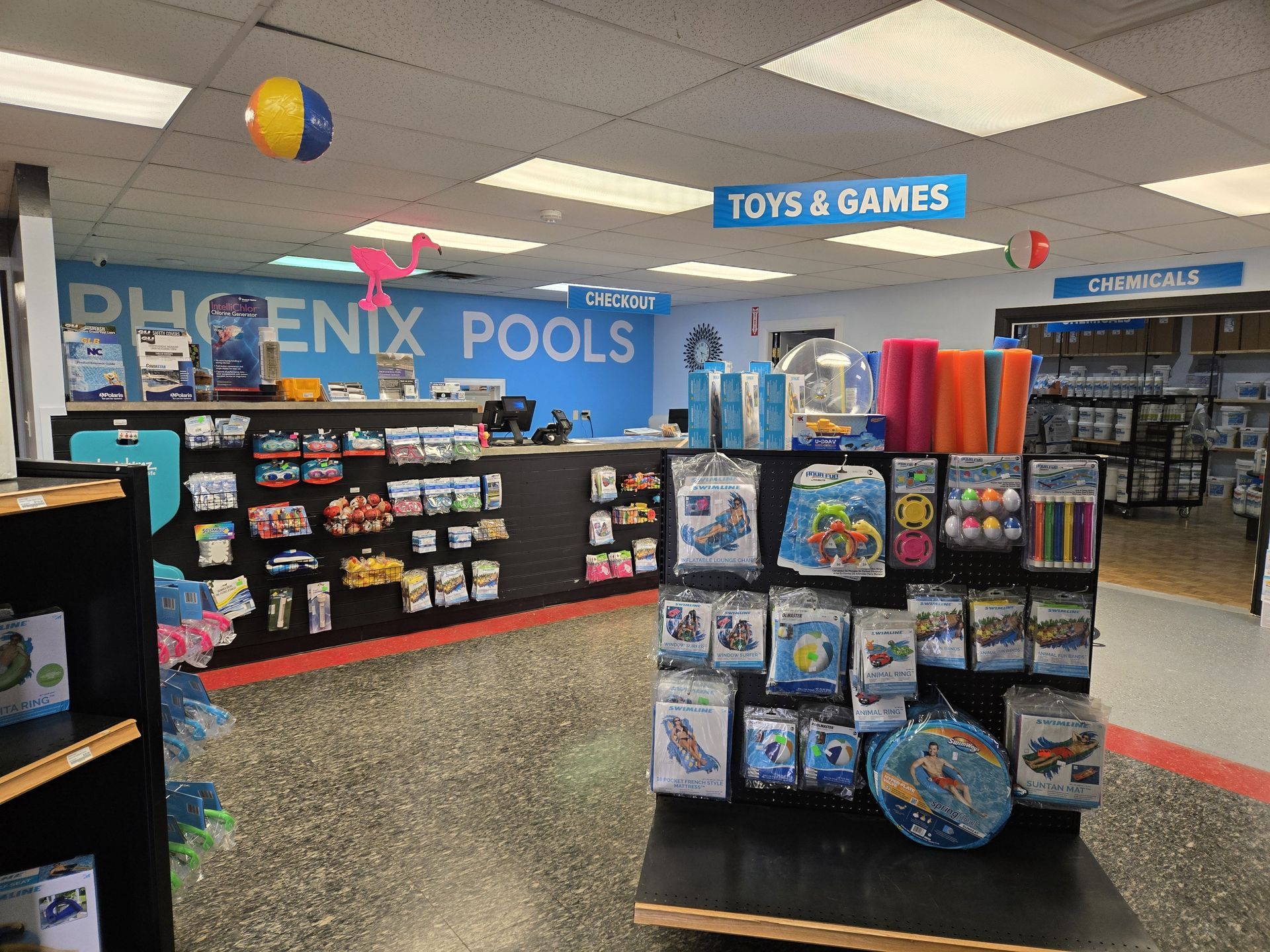 A store called phoenix pools selling toys and games