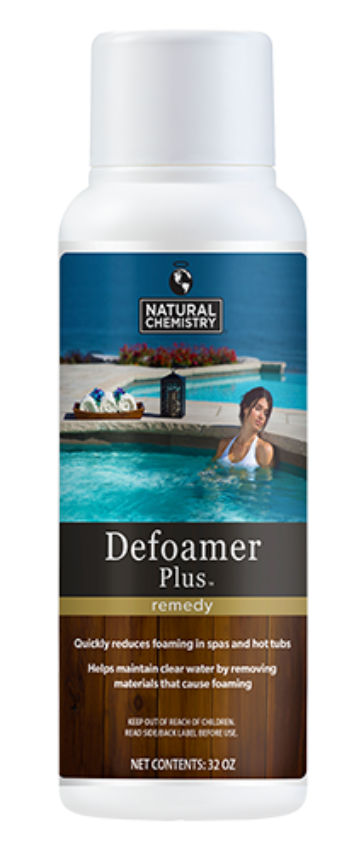 A woman is swimming in a pool next to a bottle of defoamer plus.
