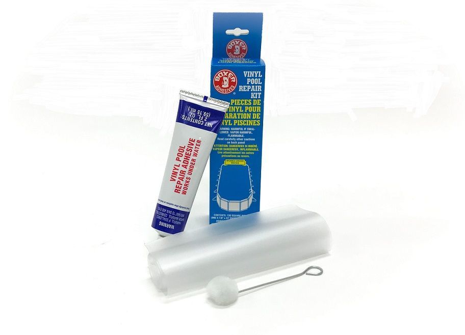 A tube of glue is sitting next to a box of glue and a plastic bag.