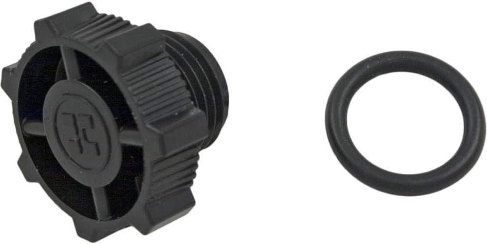 A black plastic cap and o ring on a white background.