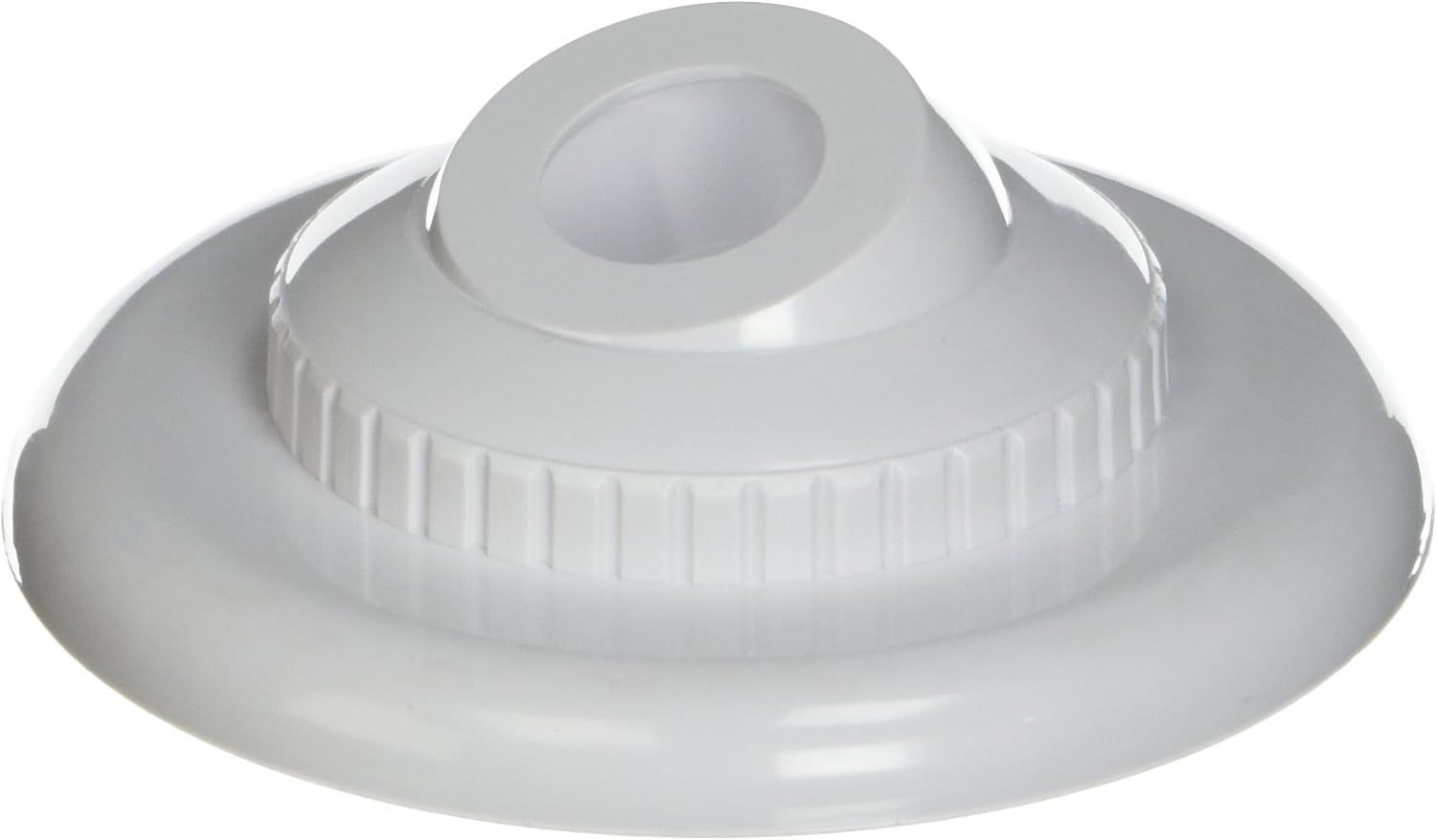 A white plastic bottle cap with a hole in the middle.