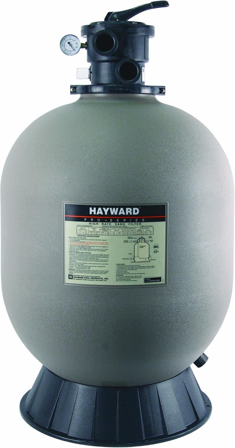 A hayward sand filter is sitting on top of a white surface.