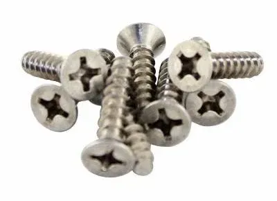 A bunch of screws are stacked on top of each other on a white background.