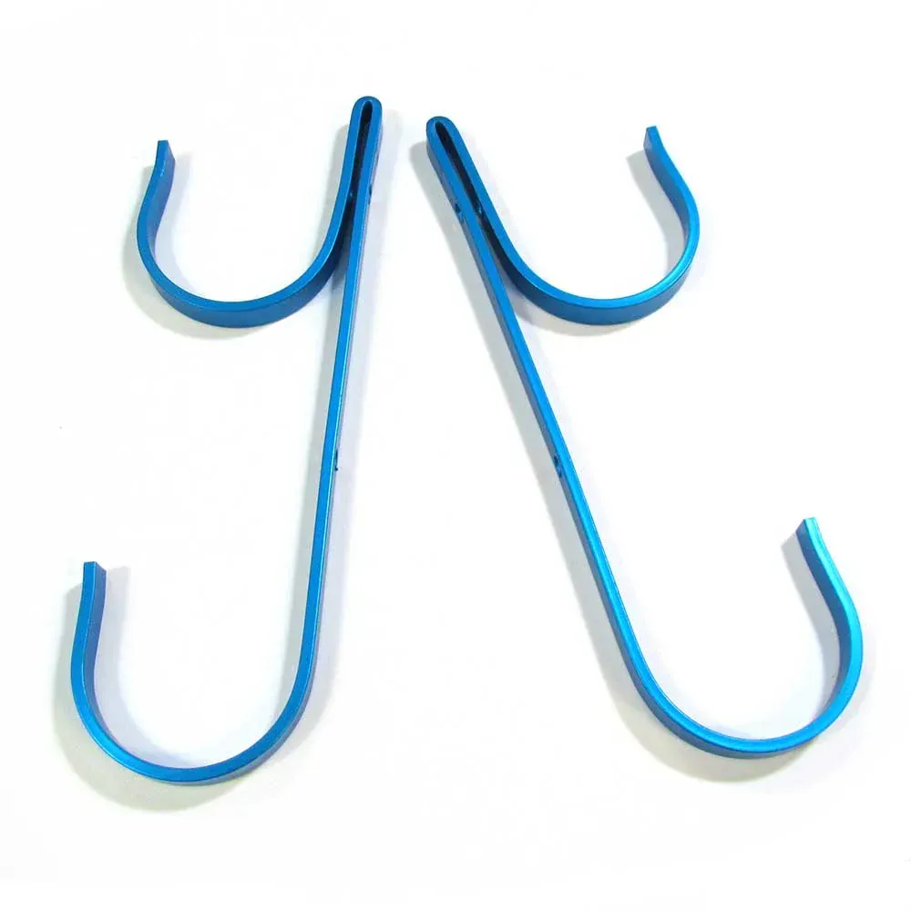 A pair of blue hooks on a white surface