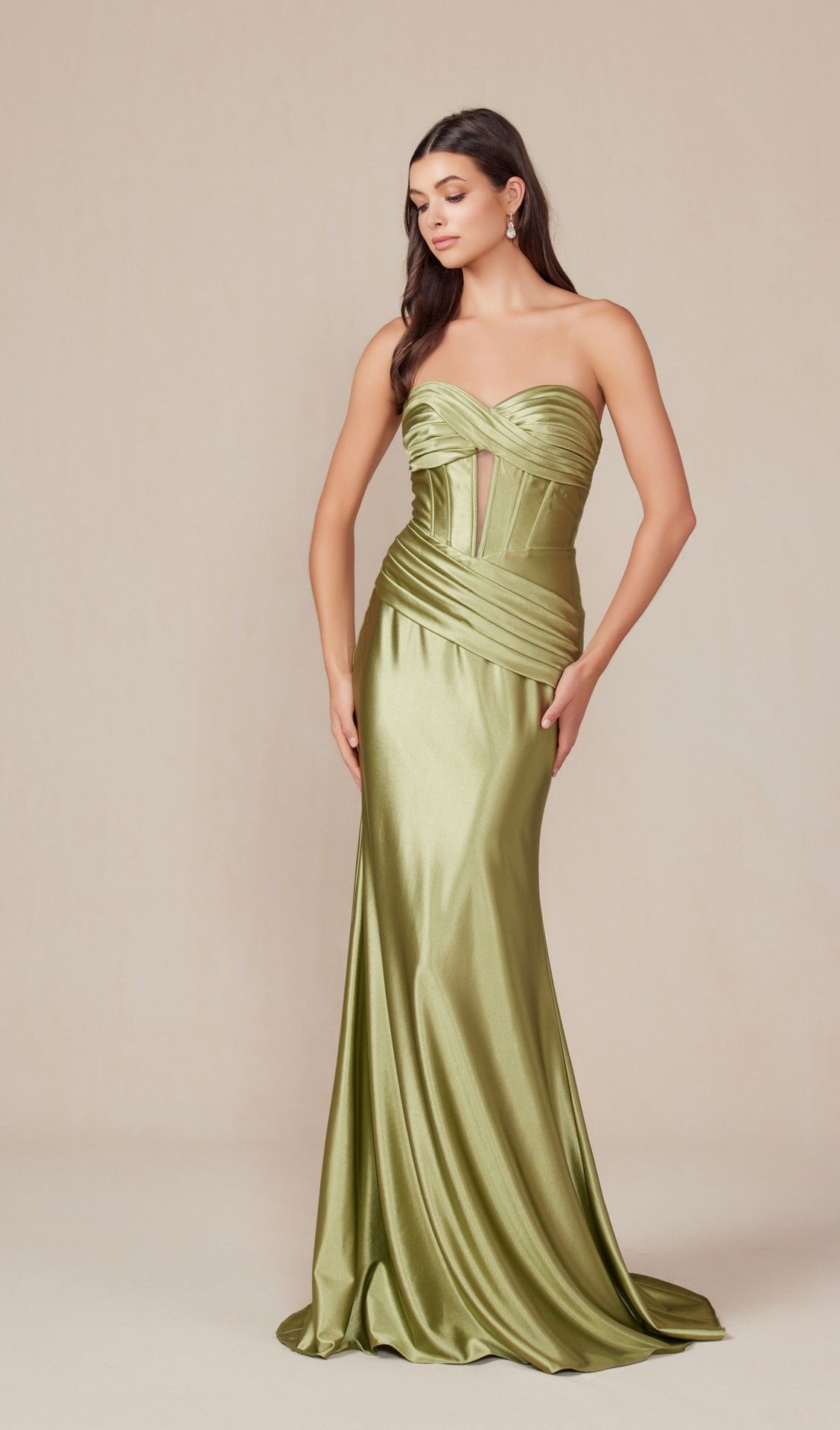 A woman in a black dress is standing on a wooden bridge.