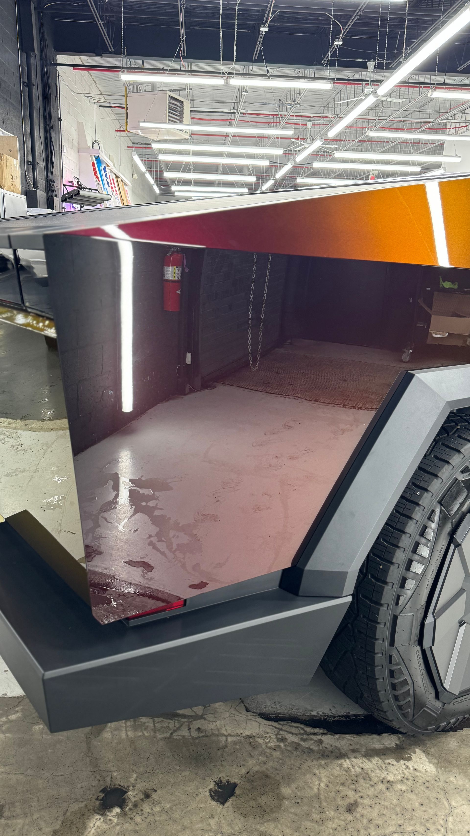 A tesla model s is parked in a garage.