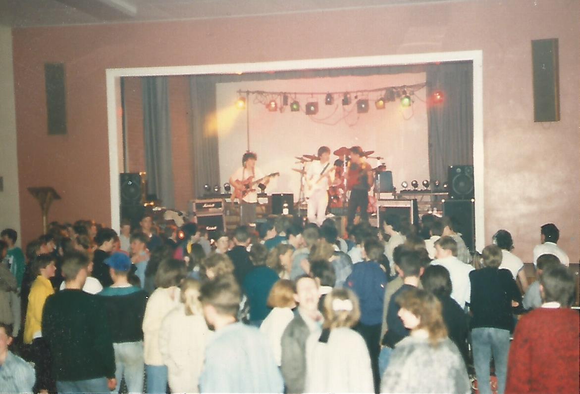 typical secondary school hall with band on stage