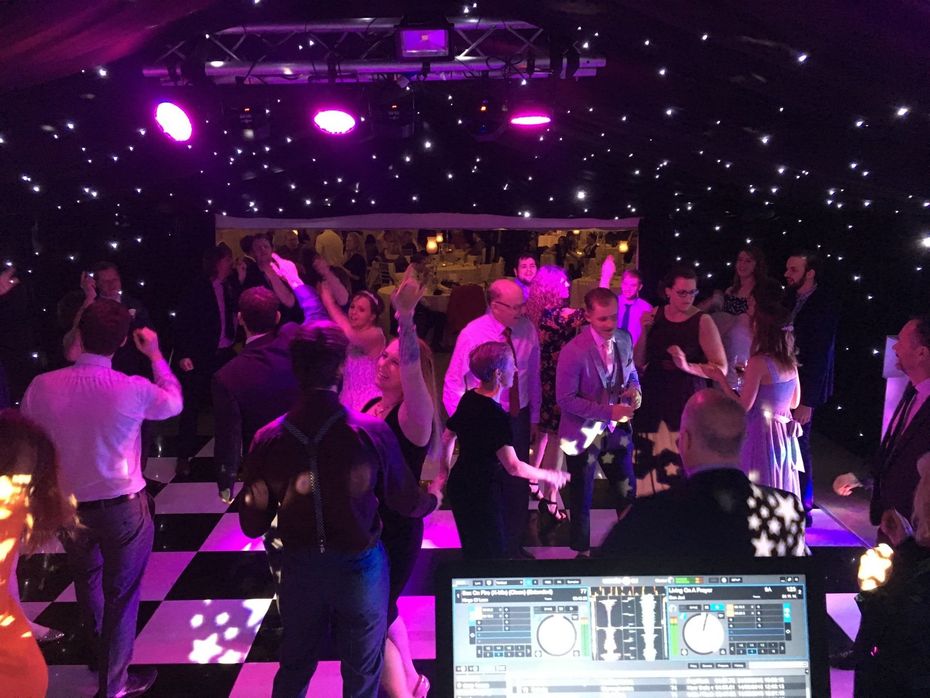 bride and crowd dancing on dance-floor at wedding party