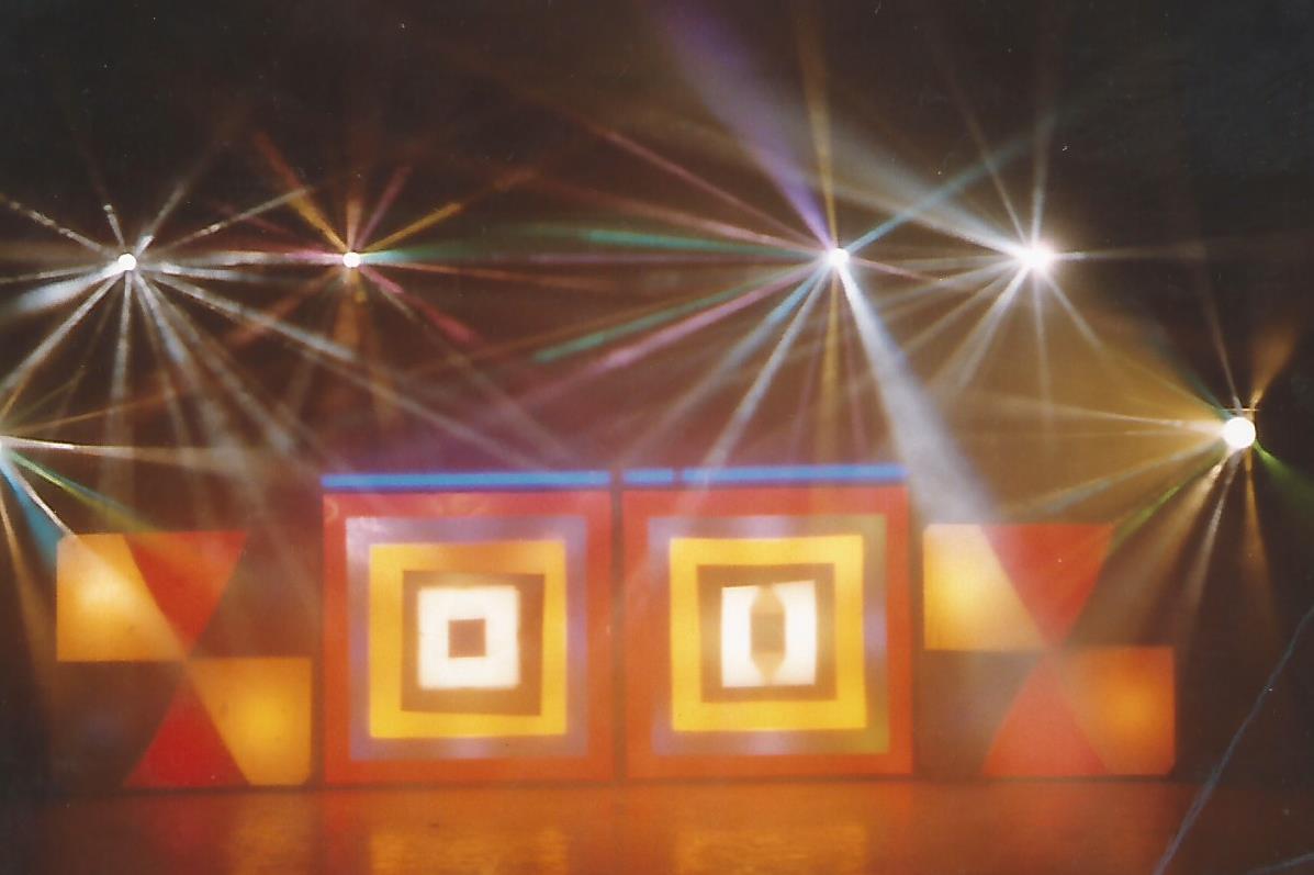 1980's disco light show with beams through smoke