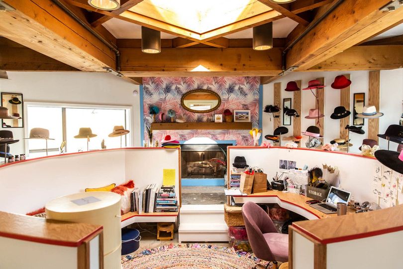 A large white building with a lot of people in it