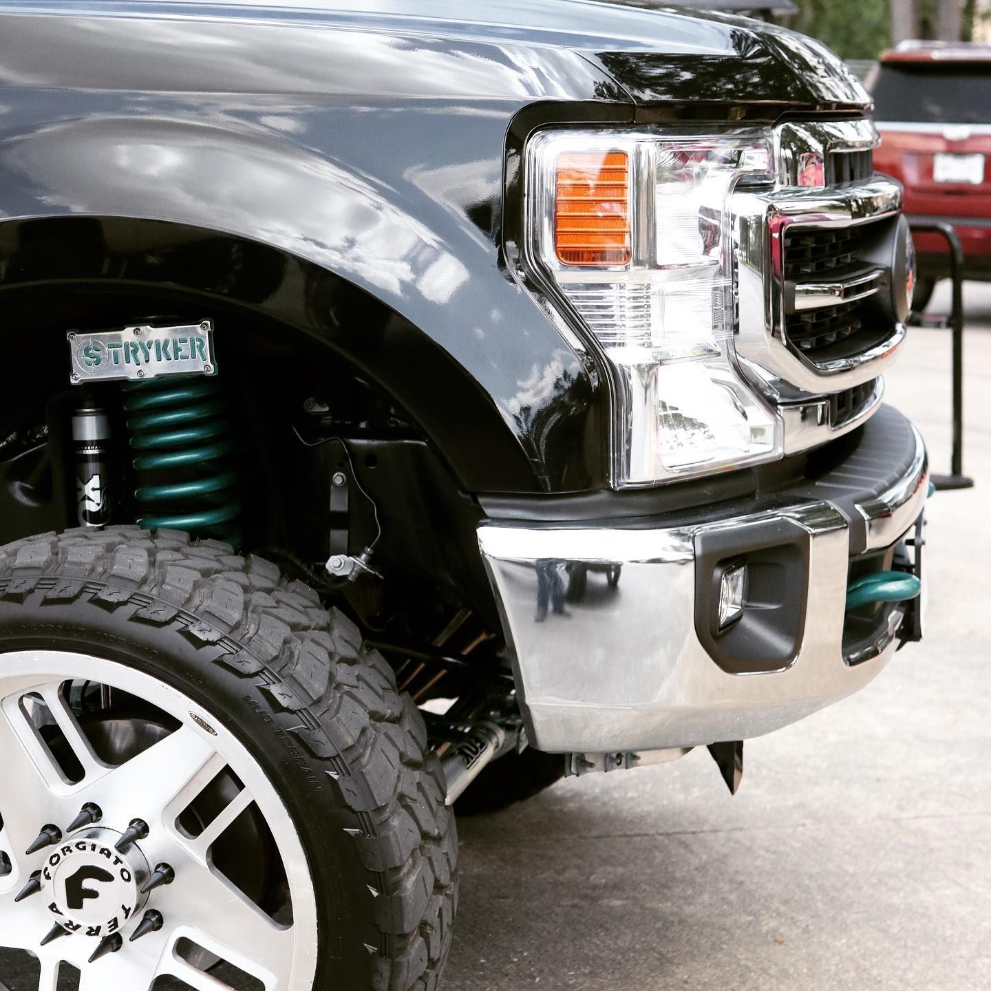 A person is fixing a brake disc on a car.