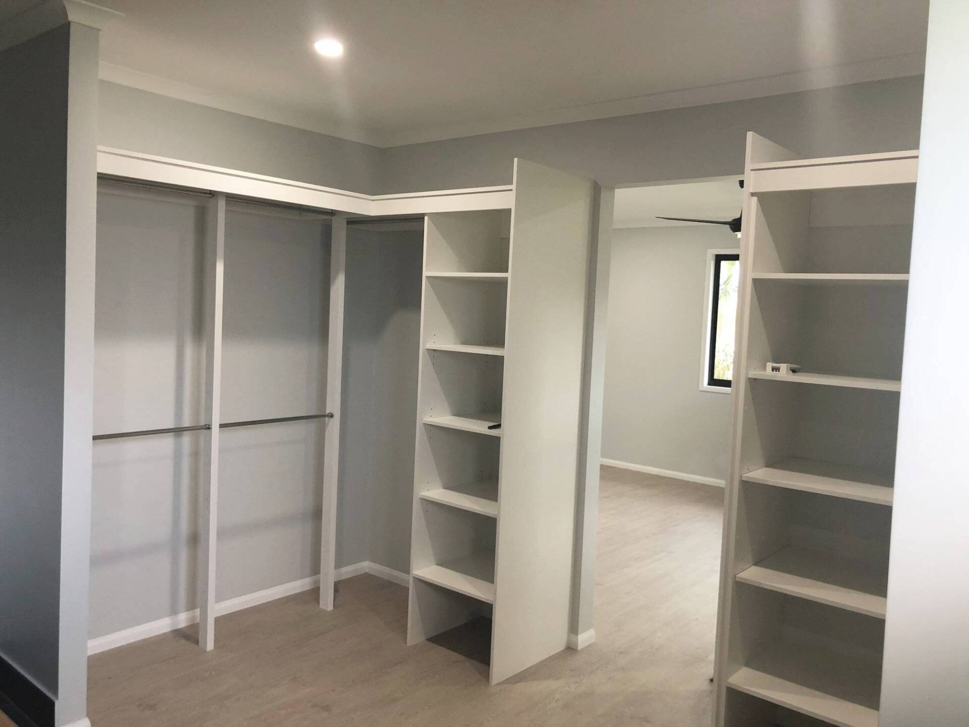 walk in wardrobe with custom built cabinetry and shelving - Mackay QLD