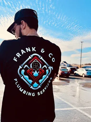 A person wearing a black t-shirt with a 